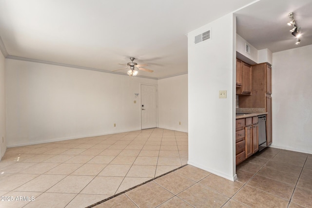 empty room with visible vents, baseboards, ceiling fan, and light tile patterned floors