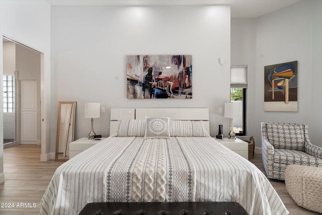 bedroom with light hardwood / wood-style floors