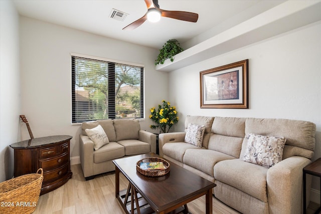 living room with ceiling fan and light hardwood / wood-style floors