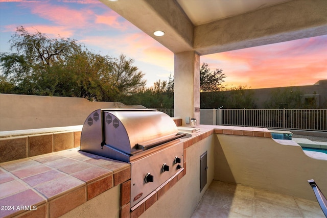 patio terrace at dusk with grilling area