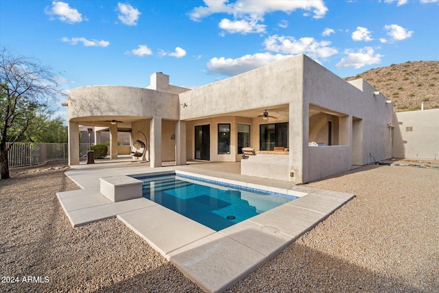 view of pool with a patio area and ceiling fan