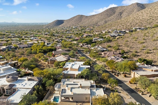 birds eye view of property with a mountain view