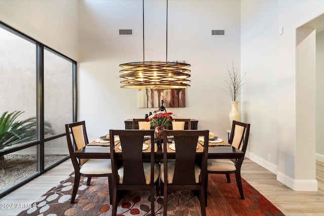 dining space featuring a chandelier and hardwood / wood-style floors