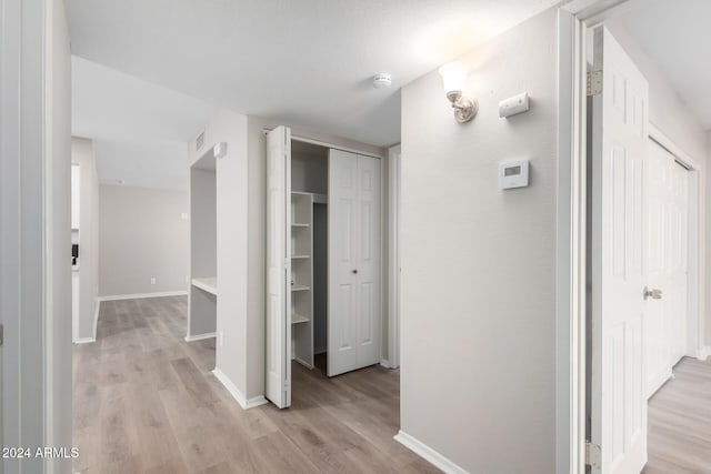 corridor featuring light wood-type flooring