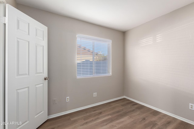 empty room with wood-type flooring