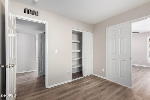 unfurnished bedroom featuring wood-type flooring