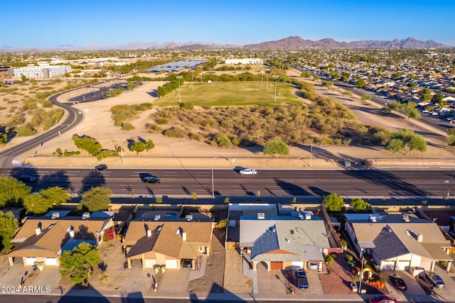 birds eye view of property with a mountain view