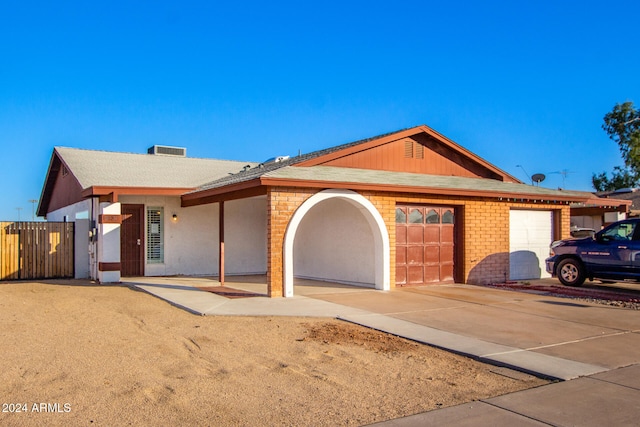 single story home with a garage