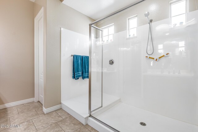 4630 E Navigator Ln, Phoenix, AZ 85050 - full bathroom with a shower stall, baseboards, and tile patterned flooring