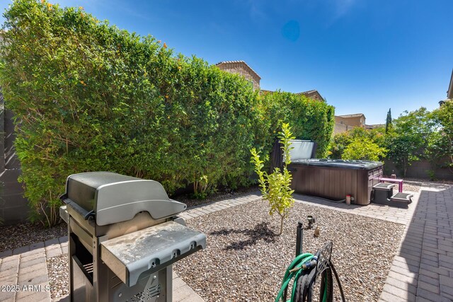 4630 E Navigator Ln, Phoenix, AZ 85050 - fenced backyard featuring a hot tub, a patio area, and grilling area