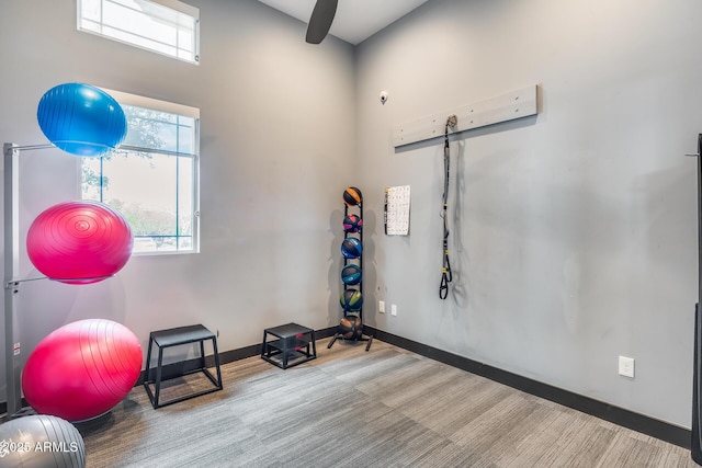 4630 E Navigator Ln, Phoenix, AZ 85050 - exercise room featuring a barn door and baseboards