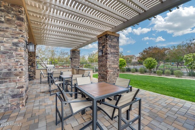 4630 E Navigator Ln, Phoenix, AZ 85050 - view of patio / terrace with outdoor dining space, a pergola, and exterior kitchen