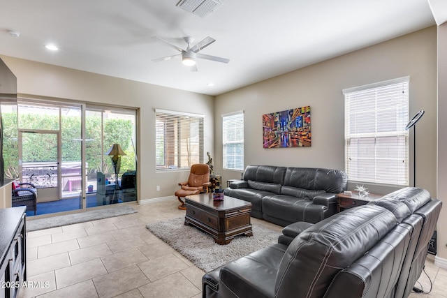 4630 E Navigator Ln, Phoenix, AZ 85050 - living room featuring ceiling fan, plenty of natural light, baseboards, light tile patterned floors, and recessed lighting