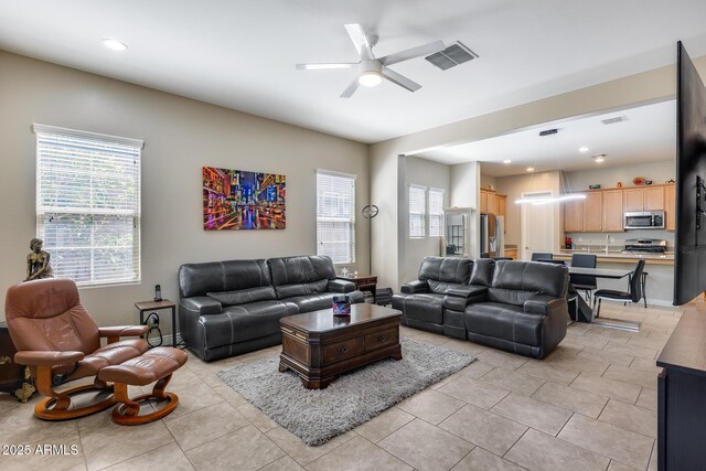 4630 E Navigator Ln, Phoenix, AZ 85050 - living area with a ceiling fan, light tile patterned floors, and recessed lighting