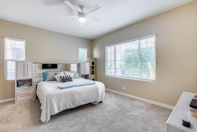 4630 E Navigator Ln, Phoenix, AZ 85050 - bedroom with baseboards, light colored carpet, and a ceiling fan