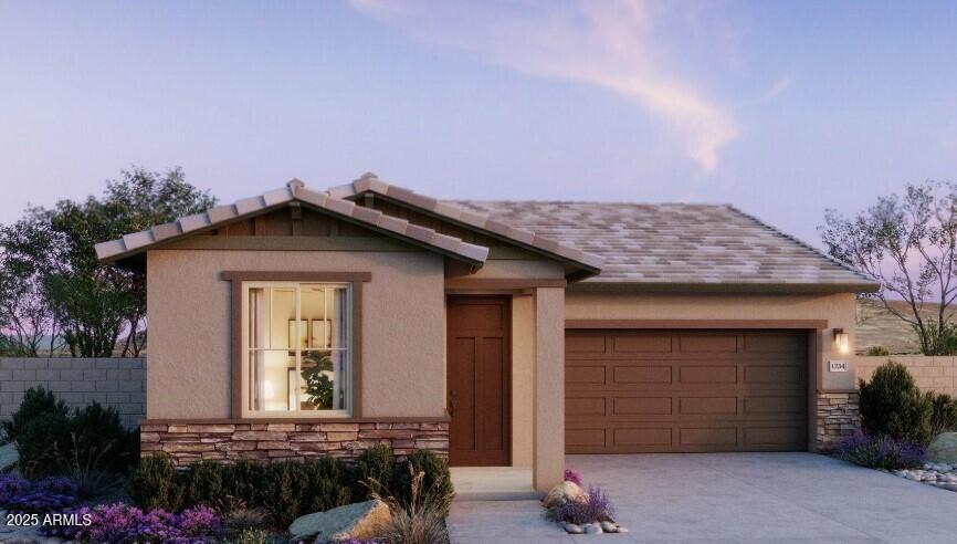 20724 N 224th Ave, Surprise, AZ 85387 - view of front of property with an attached garage, stone siding, concrete driveway, and stucco siding