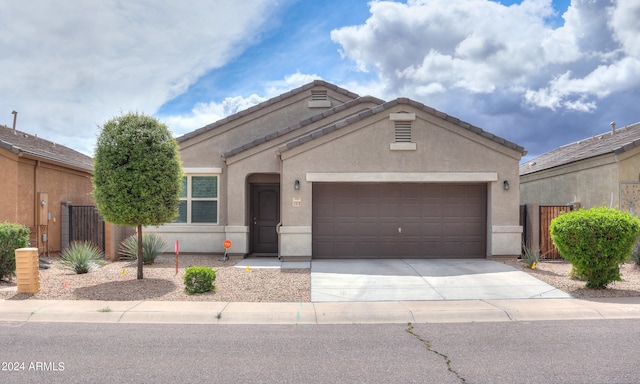 ranch-style home featuring a garage