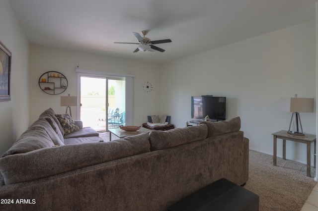 living room featuring light carpet and ceiling fan