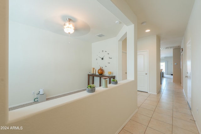 hallway featuring light tile patterned floors