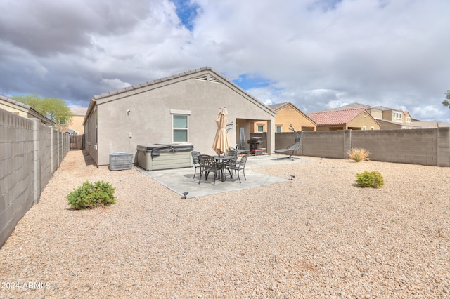 back of property with a patio area