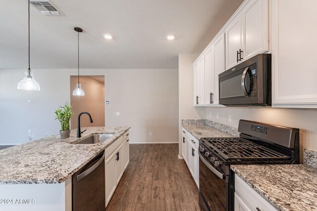 kitchen featuring black appliances, white cabinetry, and sink