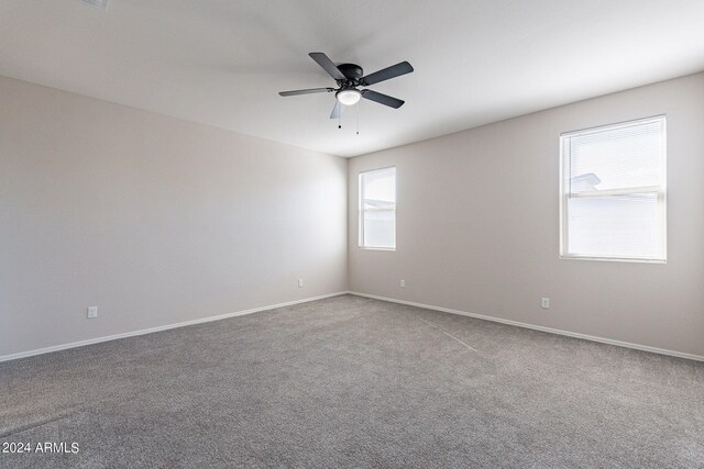 carpeted empty room with ceiling fan