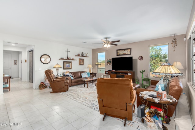 tiled living room featuring ceiling fan