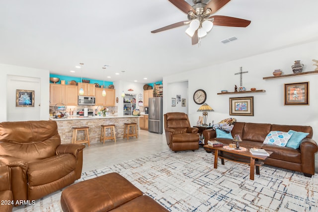 living room with ceiling fan