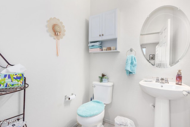 bathroom with toilet and sink