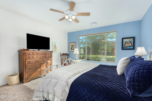 bedroom with ceiling fan and carpet floors