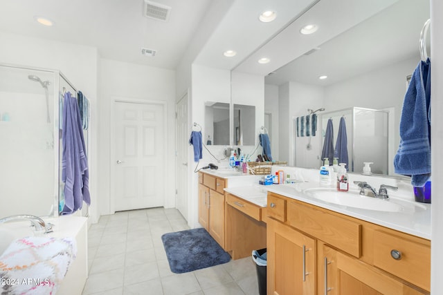 bathroom with tile patterned flooring, shower with separate bathtub, and vanity