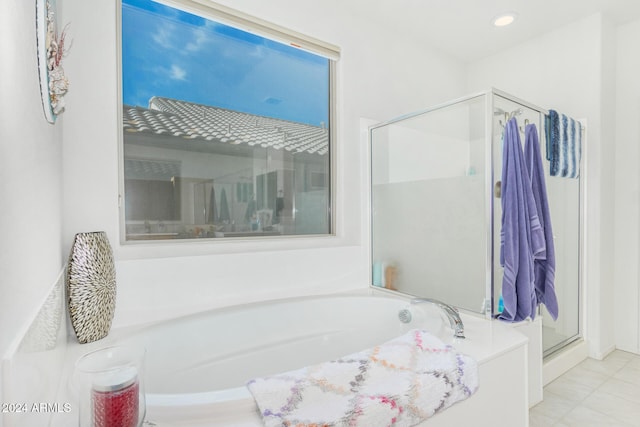 bathroom featuring tile patterned floors and plus walk in shower