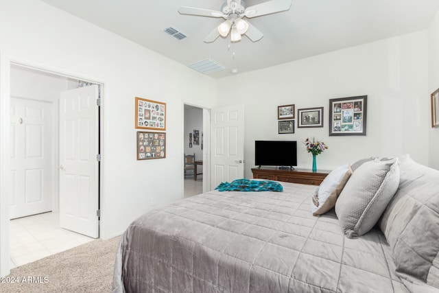 tiled bedroom with ceiling fan