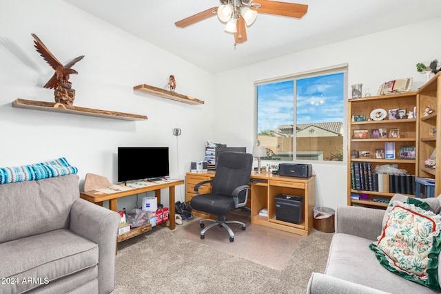 carpeted office featuring ceiling fan