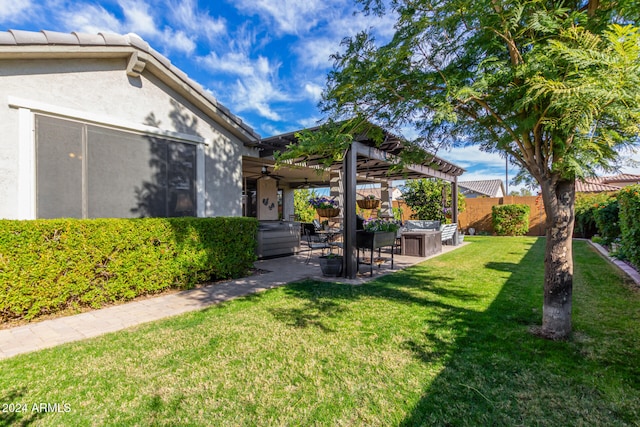 view of yard with ceiling fan and a patio area