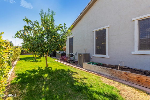 view of yard featuring central AC