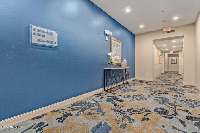 hall featuring carpet floors, recessed lighting, and baseboards