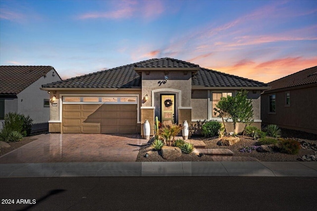 mediterranean / spanish-style home featuring a garage