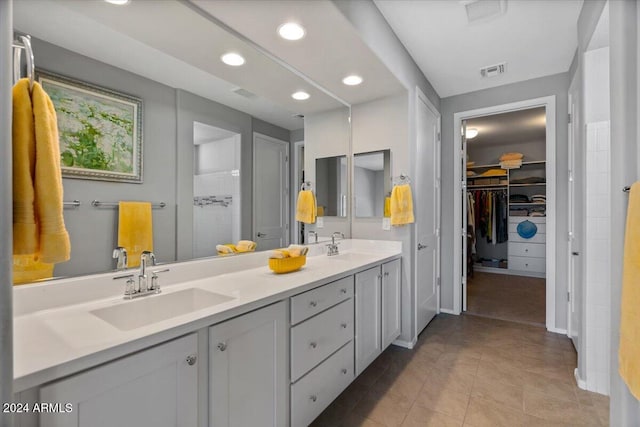 bathroom with tile patterned flooring and vanity