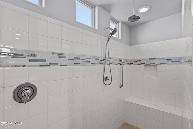 bathroom featuring tiled shower