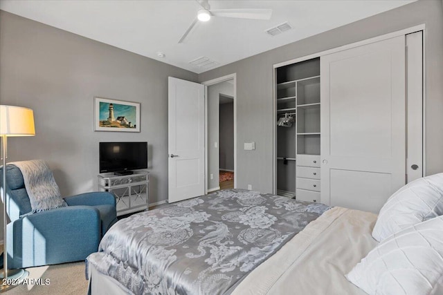 bedroom with multiple closets, ceiling fan, and carpet floors