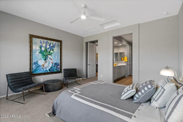 carpeted bedroom featuring ceiling fan and ensuite bathroom