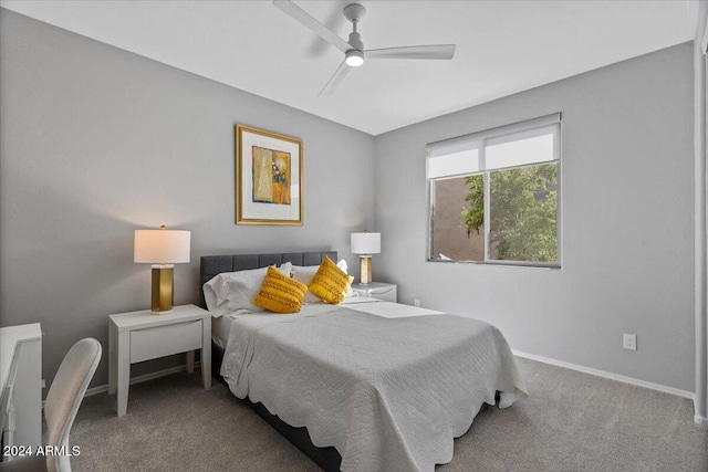 bedroom with ceiling fan and carpet floors