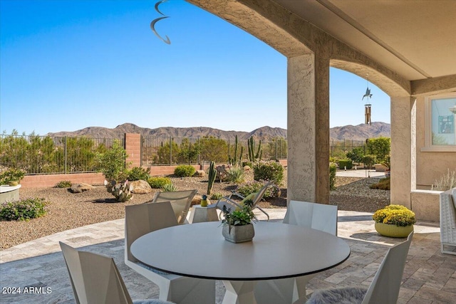 view of patio / terrace featuring a mountain view