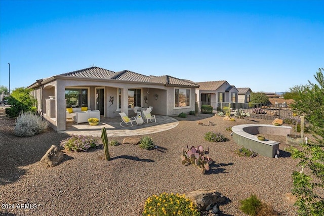 back of house featuring a patio area