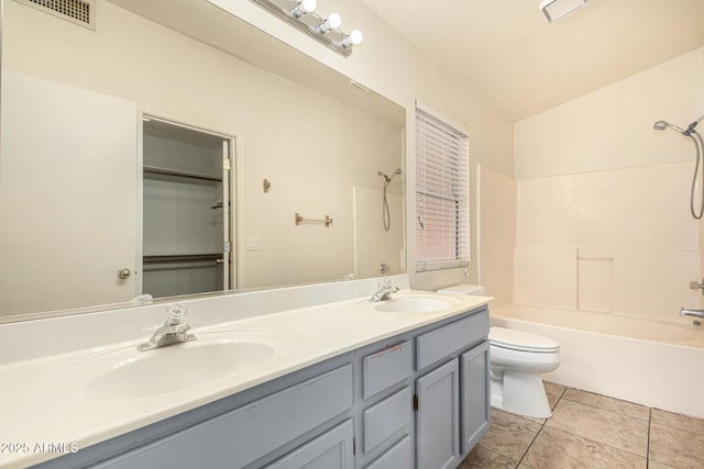 full bathroom with tile patterned floors, vaulted ceiling,  shower combination, toilet, and vanity