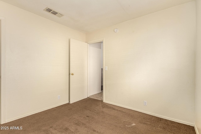 unfurnished room featuring carpet floors