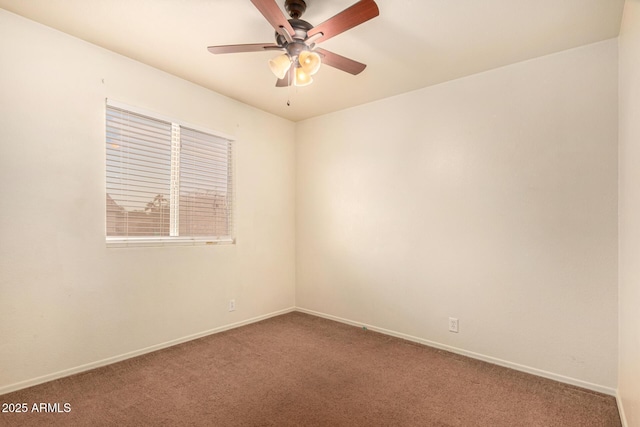 carpeted empty room with ceiling fan