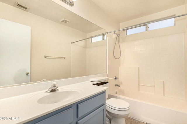 full bathroom featuring tile patterned floors, toilet, vanity, and tub / shower combination