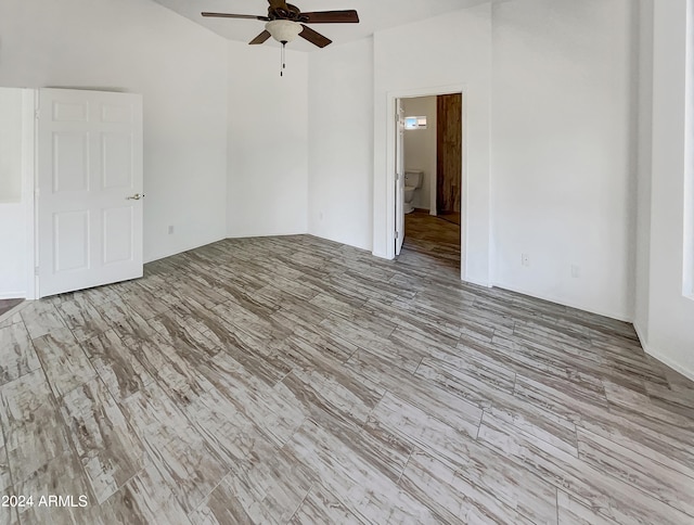 empty room with light wood-type flooring and ceiling fan